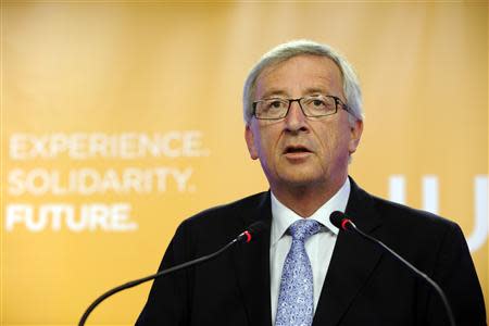 Jean Claude Junker makes a statement on the provisional results of the European elections in Brussels May 25, 2014. REUTERS/Eric Vidal