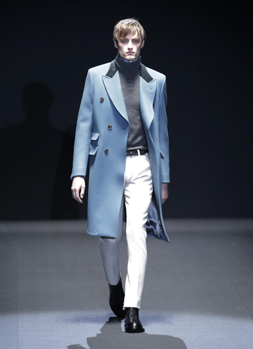 A model wears a creation for Gucci men's Fall-Winter 2013-14 collection, part of the Milan Fashion Week, unveiled in Milan, Italy, Monday, Jan. 14, 2013. (AP Photo/Antonio Calanni)