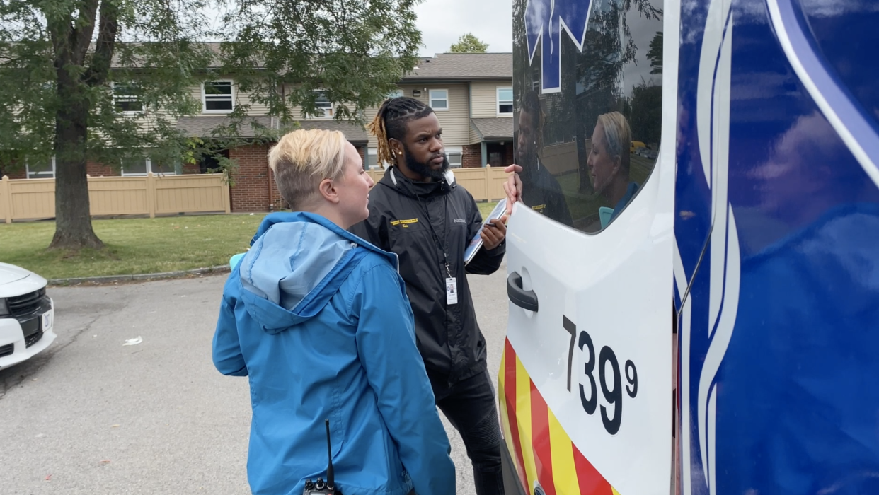 Dre’ Johnson and Renee Brean, part of Rochester’s Person in Crisis team, respond to a call in the city.  (Richard Hall / The Independent )