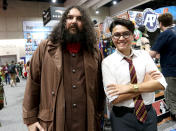 <p>Cosplayers dressed as Hagrid and Harry Potter from <i>Harry Potter</i> at Comic-Con International on July 21, 2018, in San Diego.(Photo: Angela Kim/Yahoo Entertainment) </p>