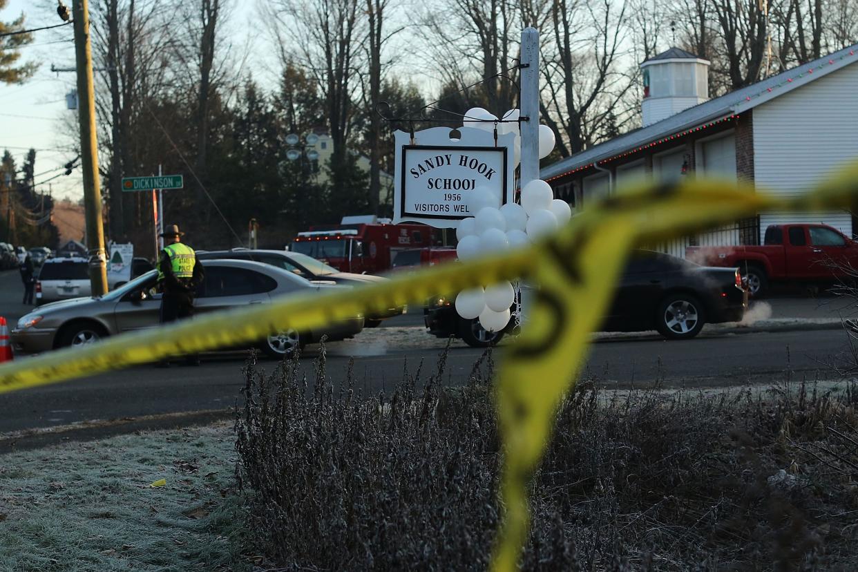 Police tape is viewed outside of the entrance to the Sandy Hook Elementary School in Newtown, Conn.