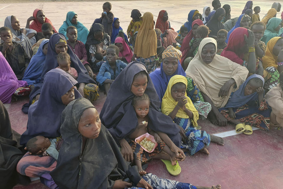Women and children who were held captive by islamic extremists, and rescued by Nigeria's army, are seen upon arrival in Maiduguri, Nigeria, Monday, May 20, 2024. Hundreds of hostages mostly children whose mothers were held captive and forcefully married by Islamic extremists in northeastern Nigeria have been rescued from their key forest enclave and handed over to authorities, the West African nation's army said late Monday. (AP Photo/Jossy Olatunji)