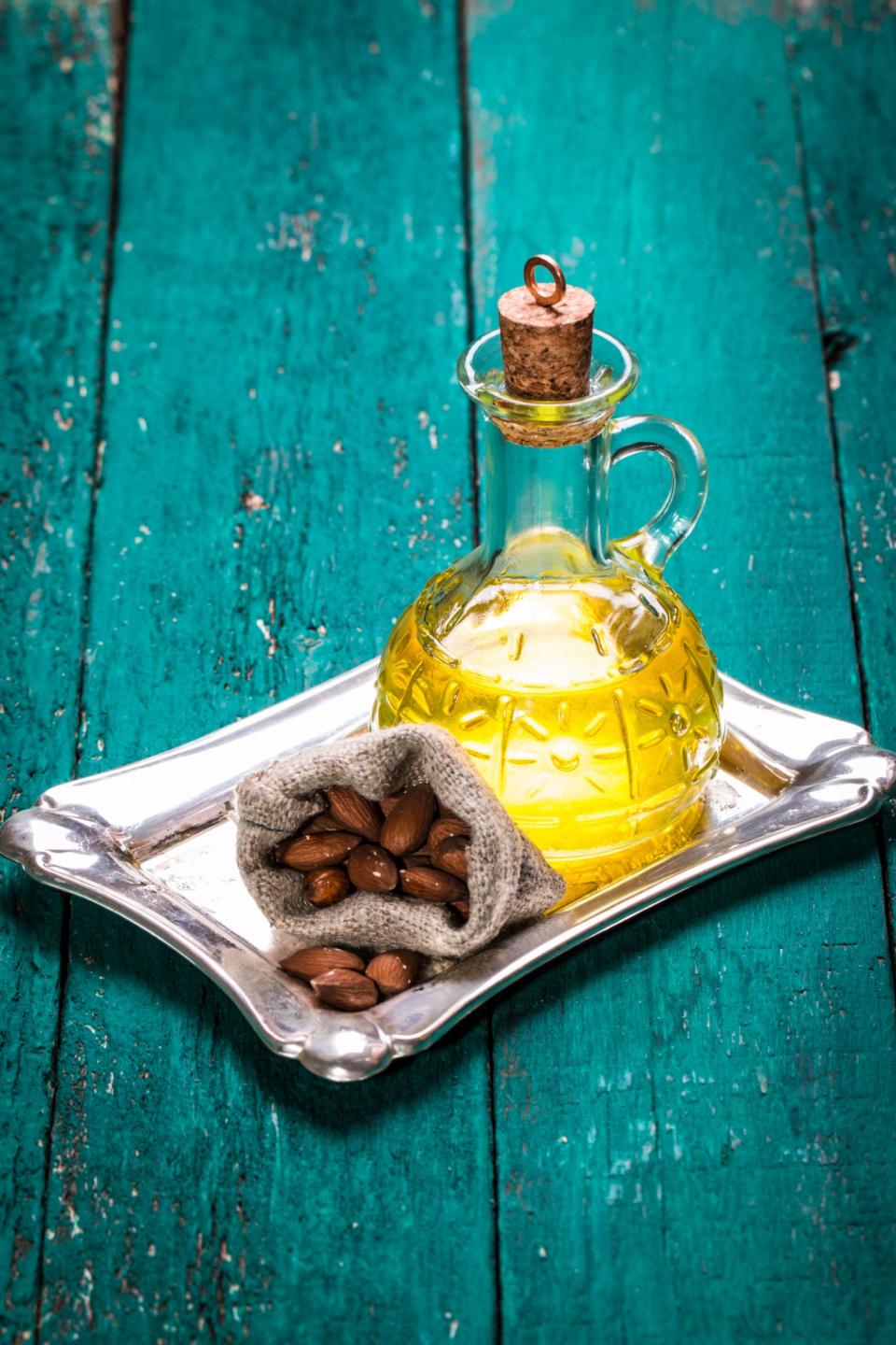 <p>Extracted from raw almonds, it owes its health benefits to the generous amounts of fatty acids, vitamin E, potassium, proteins and zinc. Sweet almond oil acts to purify skin by removing dead skin cells and nourishing new ones. <i>(Photo: Getty Images)</i> </p>