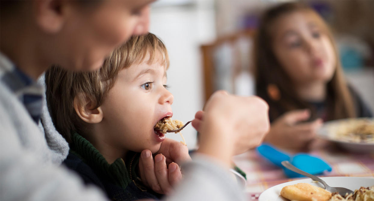 Single parent feeding her two children, to represent parents skipping own meals during cost of living crisis. (Getty Images)