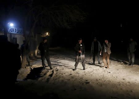 Afghan policemen keep watch at the site of an explosion in Kabul, Afghanistan January 1, 2016. REUTERS/Omar Sobhani