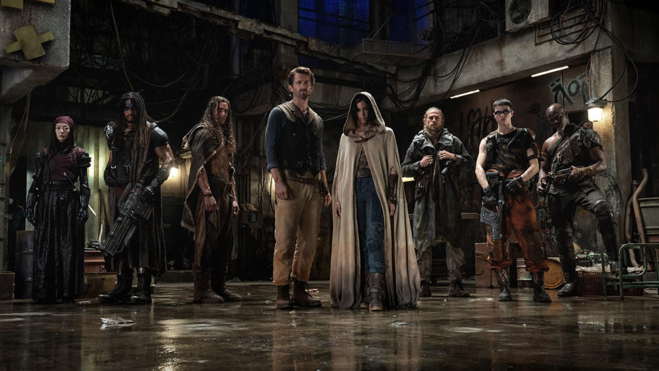 Doona Bae as Nemesis, Ray Fisher as Bloodaxe, Staz Nair as Tarak, Michiel Huisman as Gunnar, Sofia Boutella as Kora, Charlie Hunnam as Kai, E. Duffy as Milius and Djimon Hounsou as Titus in Rebel Moon.