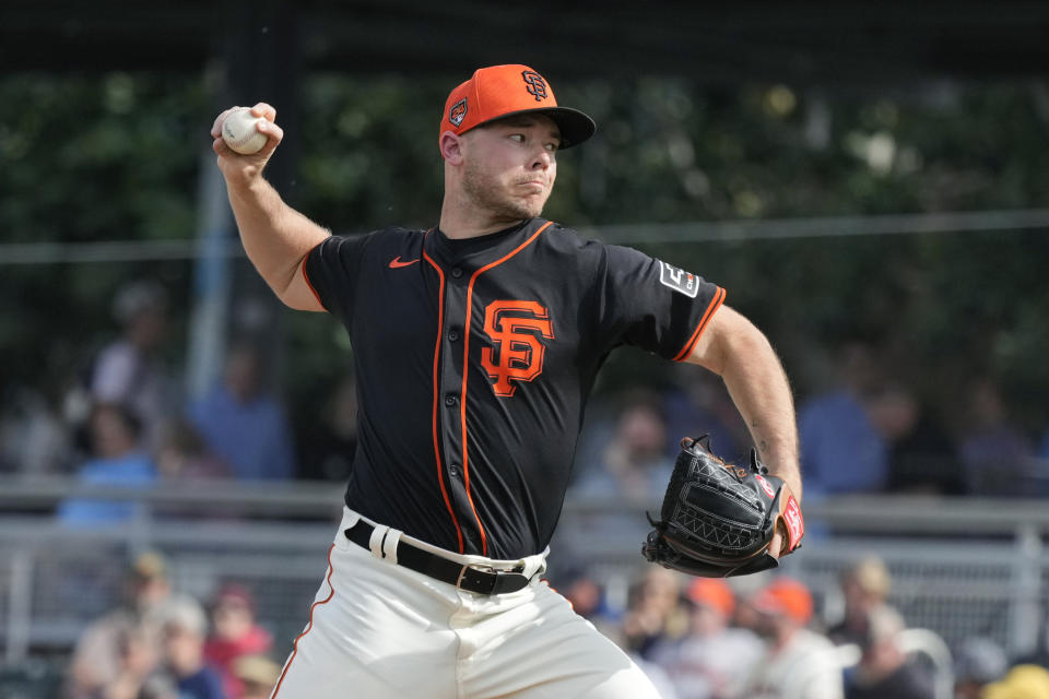 San Francisco Giants pitcher Daulton Jefferies throws against the Seattle Mariners during the fifth inning of a spring training baseball game Tuesday, Feb. 27, 2024, in Scottsdale, Ariz. Jefferies is trying to come back from a second Tommy John surgery at age 28. (AP Photo/Ross D. Franklin)