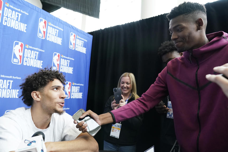 Draft Combine participant Colby Jones, left, answers a question from participant Brandon Miller during the 2023 NBA basketball Draft Combine in Chicago, Wednesday, May 17, 2023. (AP Photo/Nam Y. Huh)