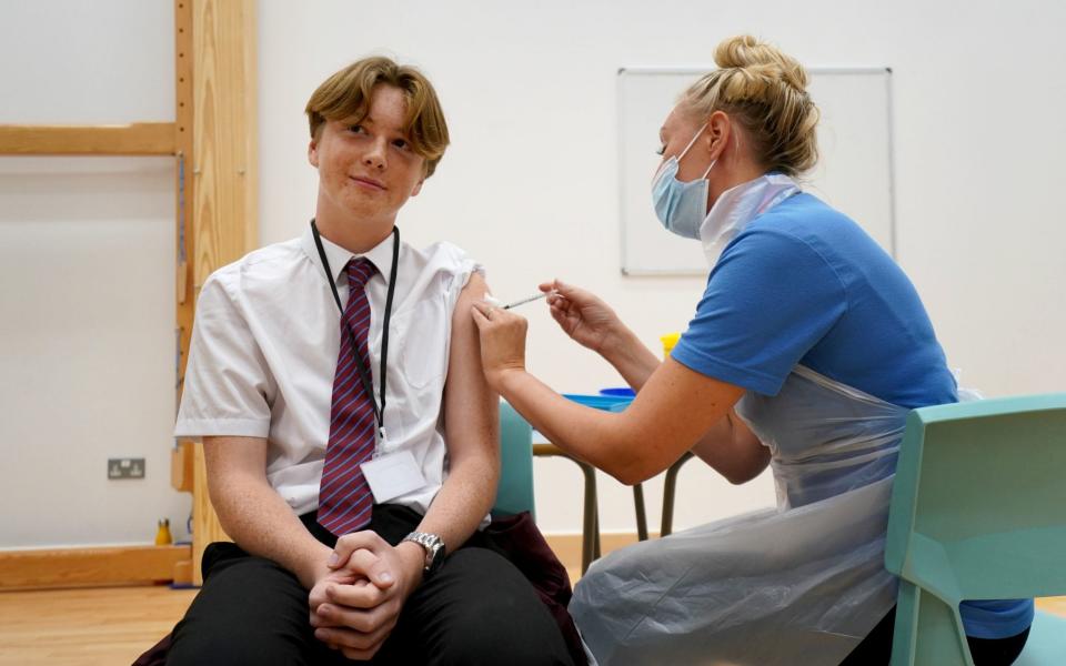 Quinn Foakes, 14, receives a Covid-19 vaccine at Belfairs Academy in Leigh-on-Sea, Essex on 20 September 2021 - Gareth Fuller/PA