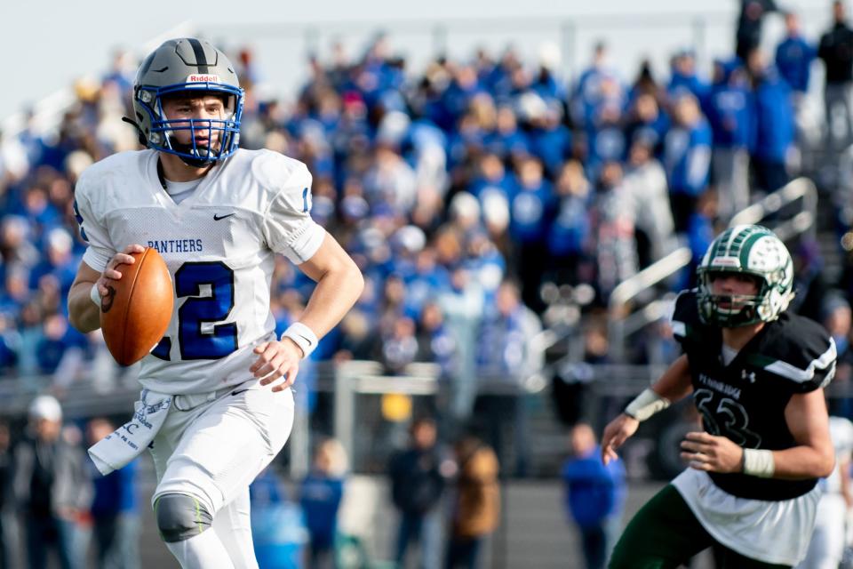 Quakertown quarterback Will Steich looks for an opening during the annual Thanksgiving game against Pennridge at Helman Field in Perkasie on Thursday, November 25, 2021. The Panthers shutout the Rams 21-0.