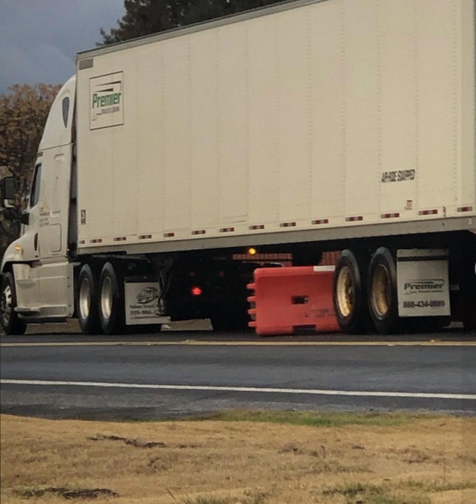 A barrier dislodged by a truck near Hansen Road.