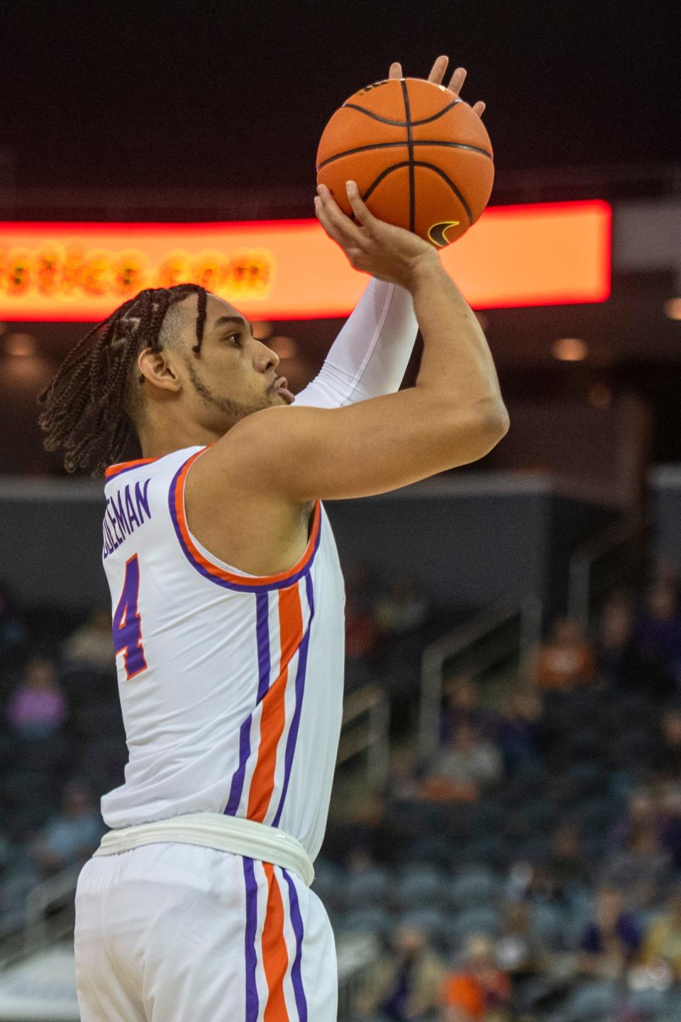 Evansville’s Marvin Coleman II (4) takes a three-point shot as the University of Evansville Purple Aces play the Oakland City Mighty Oaks at Ford Center in Evansville, Ind., Saturday, Oct 29, 2022. 