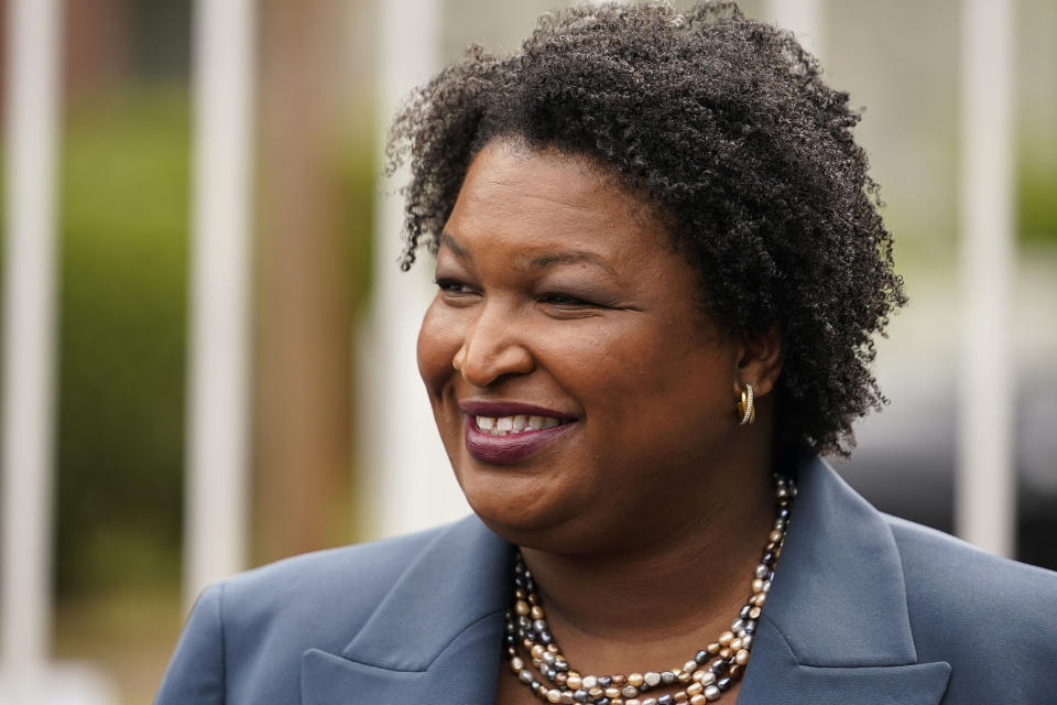 FILE - Georgia Democratic gubernatorial candidate Stacey Abrams talks to the media during Georgia's primary election on Tuesday, May 24, 2022, in Atlanta. “We know there are going to be national headwinds, there always are," said Abrams, the Democratic candidate for governor in Georgia, said recently. But she insisted she would be happy to campaign with President Joe Biden or top members of his administration: “I welcome anyone willing to lift Georgia up, to come to Georgia and help me get it done.” (AP Photo/Brynn Anderson, File)