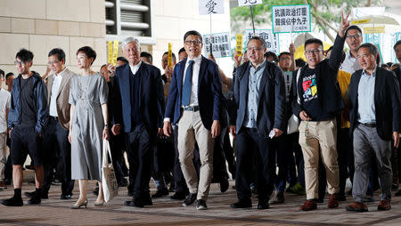 (L-R) Pro-democracy activists Chung Yiu-wa, Tanya Chan, Chu Yiu-ming, Chan Kin-man, Benny Tai, Raphael Wong and Lee Wing-tat arrive at the court before to hear a verdict on their involvement in the Occupy Central, also known as "Umbrella Movement", in Hong Kong, China April 9, 2019. REUTERS/Tyrone Siu/Files