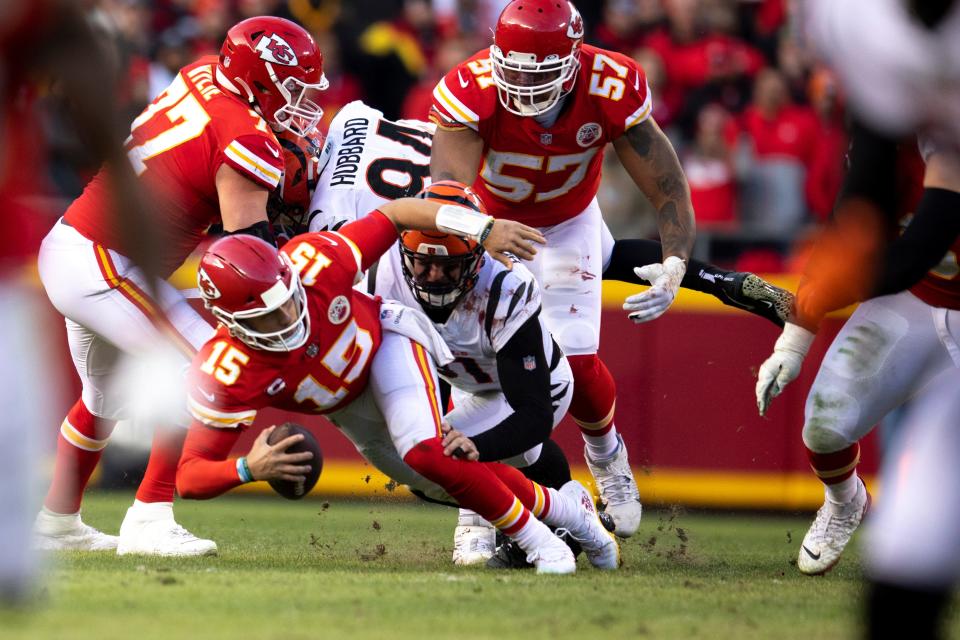 Bengals defensive end Sam Hubbard sacks Kansas City Chiefs quarterback Patrick Mahomes in AFC Championship Game in January 2022.