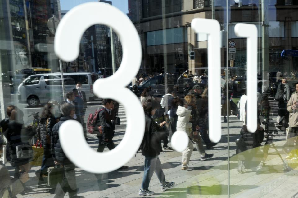 The number "3.11" meaning March 11 is shown at a store for an annual tribute for the victims of a 2011 disaster Monday, March 11, 2024, in Tokyo. Japan on Monday marked the 13th anniversary of the massive earthquake, tsunami and nuclear disaster that struck Japan's northeastern coast. (AP Photo/Eugene Hoshiko)