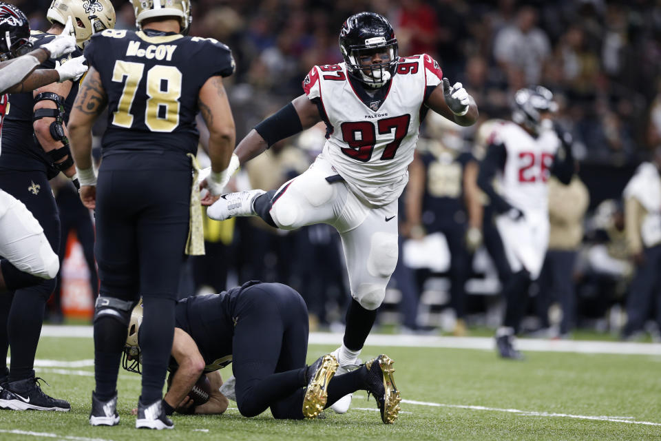 Atlanta Falcons defensive tackle Grady Jarrett (97) celebrates his sack of New Orleans Saints quarterback Drew Brees, on ground, in the second half of an NFL football game in New Orleans, Sunday, Nov. 10, 2019. (AP Photo/Rusty Costanza)