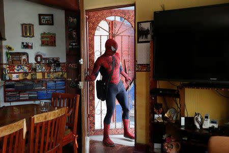 Moises Vazquez, 26, known as Spider-Moy, a computer science teaching assistant at the Faculty of Science of the National Autonomous University of Mexico (UNAM), who teaches dressed as a comic superhero Spider-Man, leaves home in Iztapalapa neighbourhood, in Mexico City, Mexico, May 27, 2016. REUTERS/Edgard Garrido