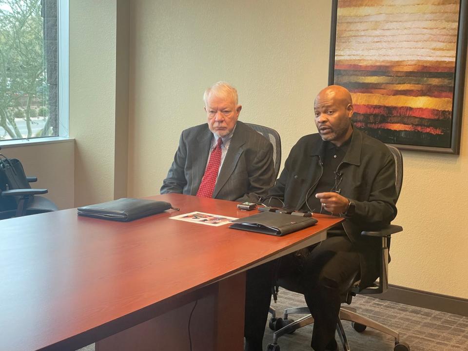 Jason Glenn (right) and his lawyer, Randall Stone, announce the filing of a lawsuit against Eastlake Mortuary in Phoenix, on Thursday, March 2, 2023.