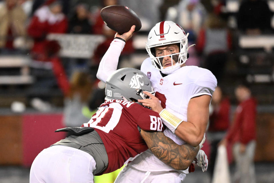 Nov 4, 2023; Pullman, Washington, USA; Stanford Cardinal quarterback Justin Lamson (8) is hit while throwing a pass by Washington State Cougars defensive end Brennan Jackson (80) in the second half at Gesa Field at Martin Stadium. Stanford won 10-7. Mandatory Credit: James Snook-USA TODAY Sports