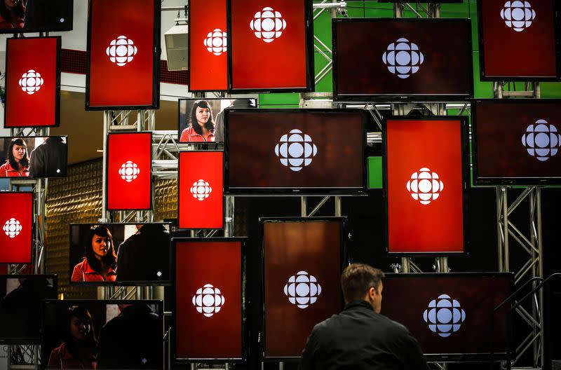 FILE PHOTO: A man sits inside the Canadian Broadcast Corporation broadcasting centre in Toronto