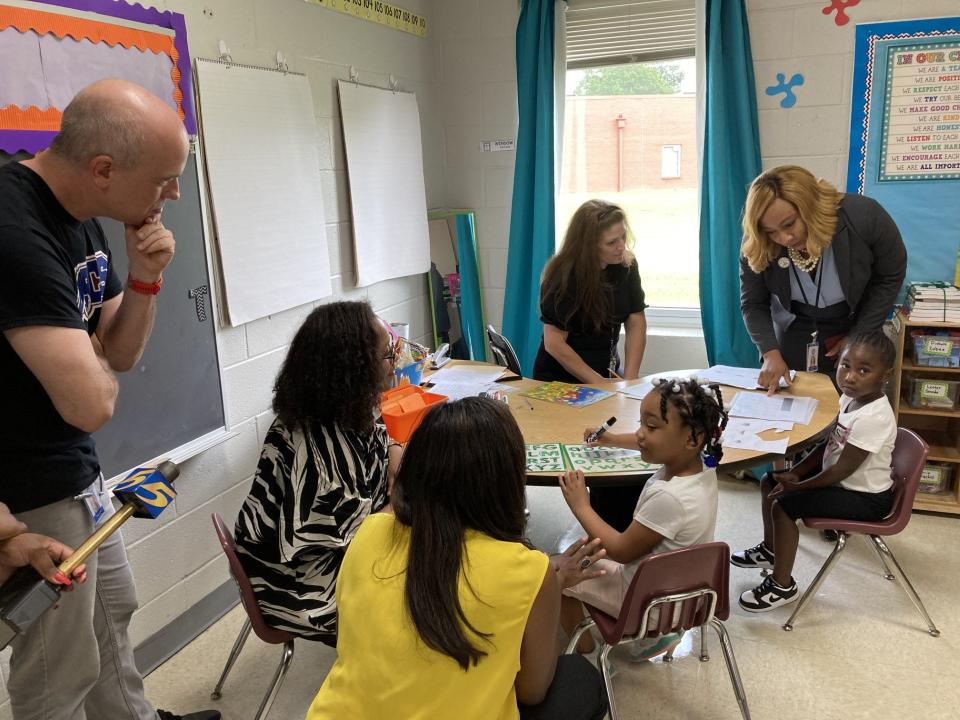 School and district leaders meet with kindergarteners and a teacher at Highland Oaks Elementary School on Aug. 7, 2023, in Memphis.