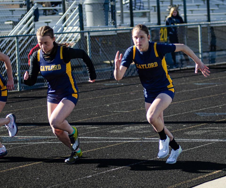 Katie Berkshire (right) set a new personal best time in the 800-meter run this week.