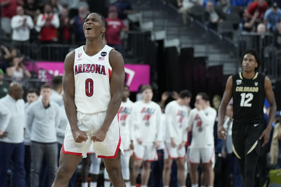 NCAA tournament: Arizona's Bennedict Mathurin (0) celebrates after Arizona defeated Colorado in an NCAA college basketball game in the semifinal round of the Pac-12 tournament Friday, March 11, 2022, in Las Vegas. (AP Photo/John Locher)