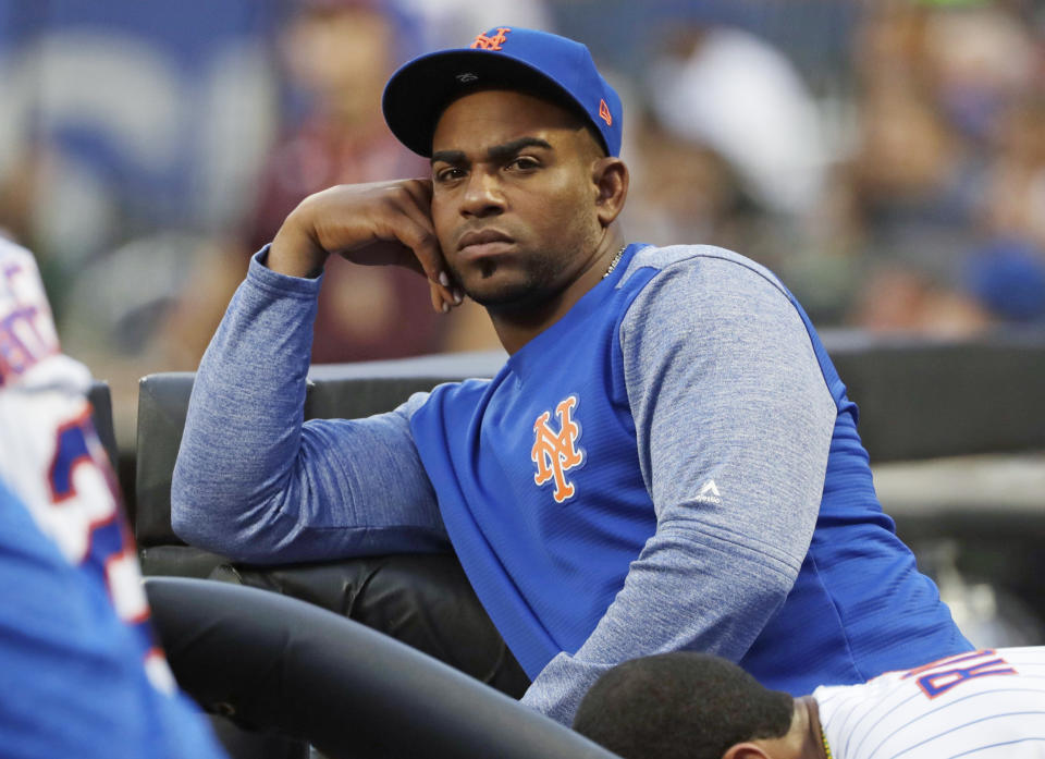 New York Mets' Yoenis Cespedes watches his team play the San Diego Padres during the first inning of a baseball game Tuesday, July 24, 2018, in New York. (AP Photo/Frank Franklin II)