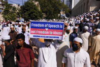 Supporters of several Islamist parties protest after Friday prayers in Dhaka, Bangladesh, Friday, Oct. 30, 2020. Thousands of Muslims and activists marched through streets and rallied across Bangladesh’s capital on Friday against the French president’s support of secular laws that deem caricatures of the Prophet Muhammad as protected under freedom of speech. (AP Photo/Mahmud Hossain Opu)