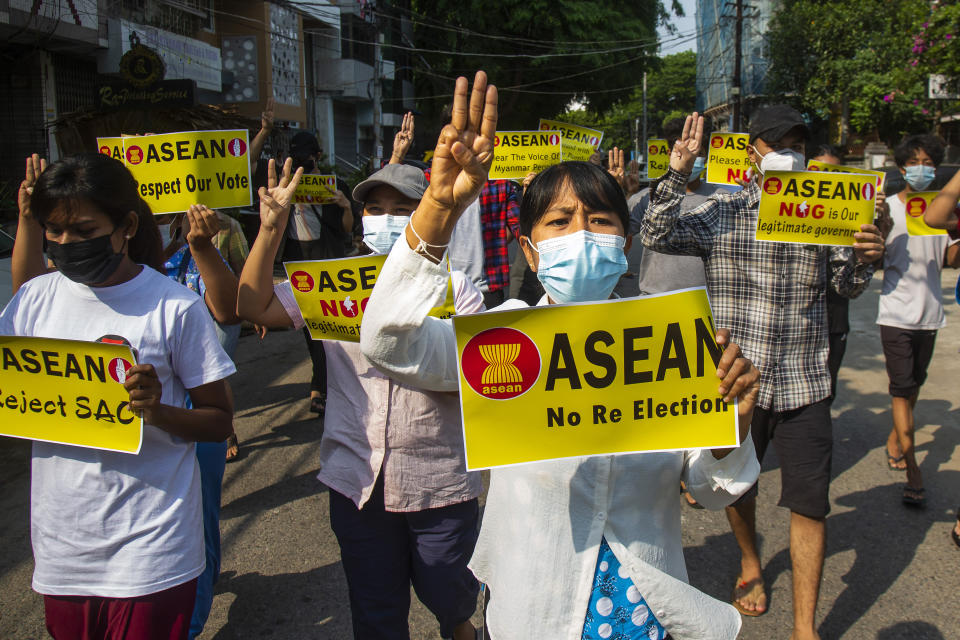 Anti-coup protesters flash the three-finger sign of defiance during the demonstration against the military coup in Yangon, Myanmar, on Friday, April 23, 2021. Leaders of the 10-member Association of Southeast Asian Nations meet Saturday, April 24, in Jakarta to consider plans to promote a peaceful resolution of the conflict that has wracked Myanmar since its military launched a deadly crackdown on opponents to its seizure of power in February. (AP Photo)