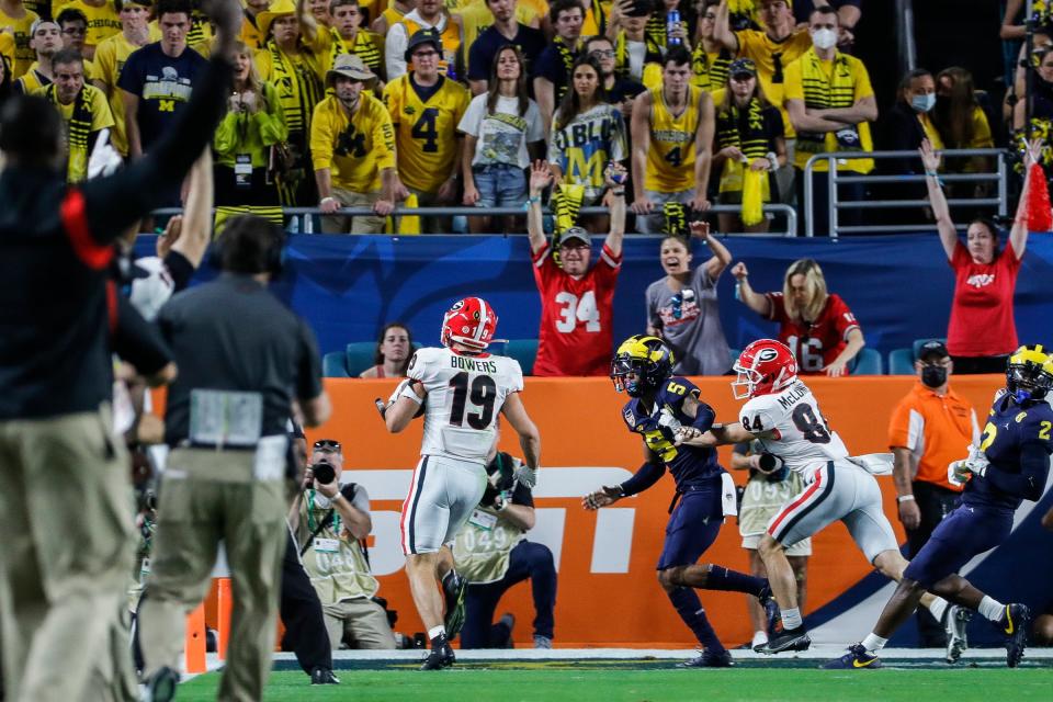 Georgia tight end Brock Bowers (19) scores a touchdown against Michigan during the first half of the Orange Bowl at the Hard Rock Stadium in Miami, Fla., on Friday, Dec. 31, 2021.