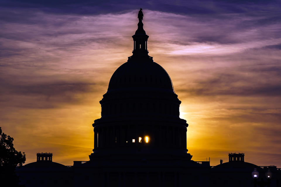 The sun rises behind the Capitol in Washington, Wednesday, Sept. 15, 2021. (AP Photo/J. Scott Applewhite)