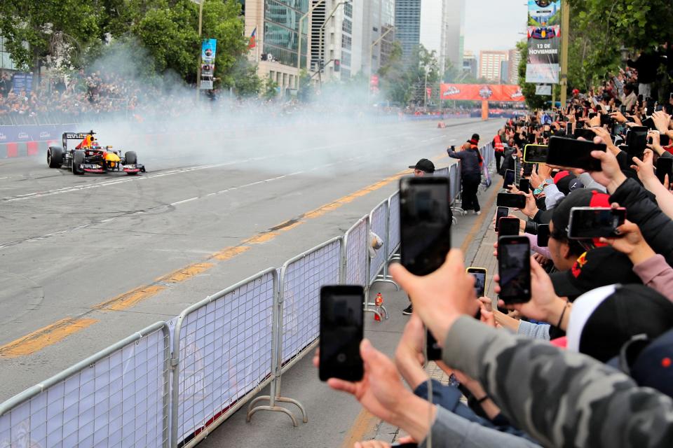 Former Formula 1 driver Austrian Patrick Friesacher drives the Oracle Red Bull Racing RB7 during the Red Bull Showrun in Santiago on November 12, 2023.