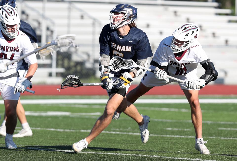 Pelham's Eric Elbery (6) fires a shot against Burnt Hills-Ballston Lake during the boys lacrosse Class C regional final at Shaker High School in Albany June 4, 2022. Burnt Hills-Ballston Lake won the game.