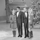 <p>Longtime pals, Dean Martin and Frank Sinatra, are joined by their daughters, Gail Martin and Nancy Sinatra, for a Christmas segment on <em>The Dean Martin Show. </em>Afterwards other members of their families joined in on the holiday fun.</p>