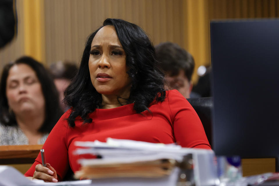 Fulton County District Attorney Fani Willis looks on during a hearing on the Georgia election interference case, Friday, March, 1, 2024, in Atlanta. The hearing is to determine whether Fulton County District Attorney Fani Willis should be removed from the case because of a relationship with Nathan Wade, special prosecutor she hired in the election interference case against former President Donald Trump. (AP Photo/Alex Slitz, Pool)