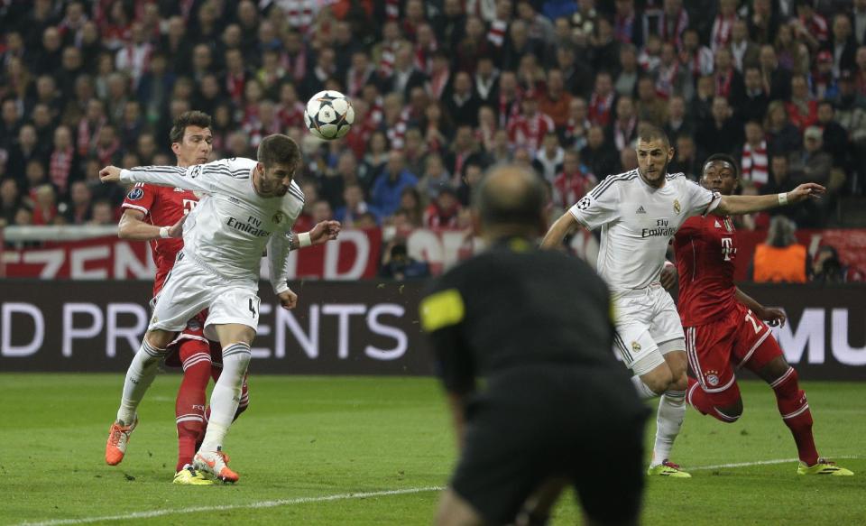 Real's Sergio Ramos, second left, scores his side's 2nd goal during the Champions League semifinal second leg soccer match between Bayern Munich and Real Madrid at the Allianz Arena in Munich, southern Germany, Tuesday, April 29, 2014. (AP Photo/Matthias Schrader)