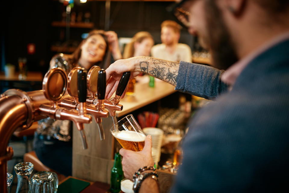 Man pouring beer into a glass