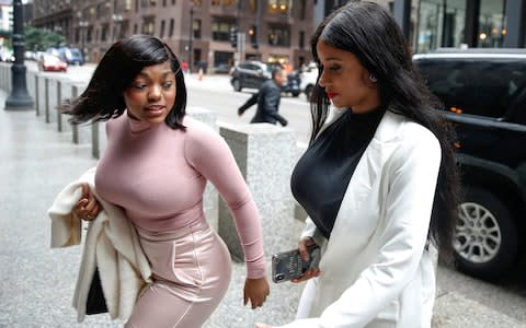 Joycelyn Savage and and Azriel Clary arrive for R. Kelly detention hearing in Chicago - Credit: Reuters