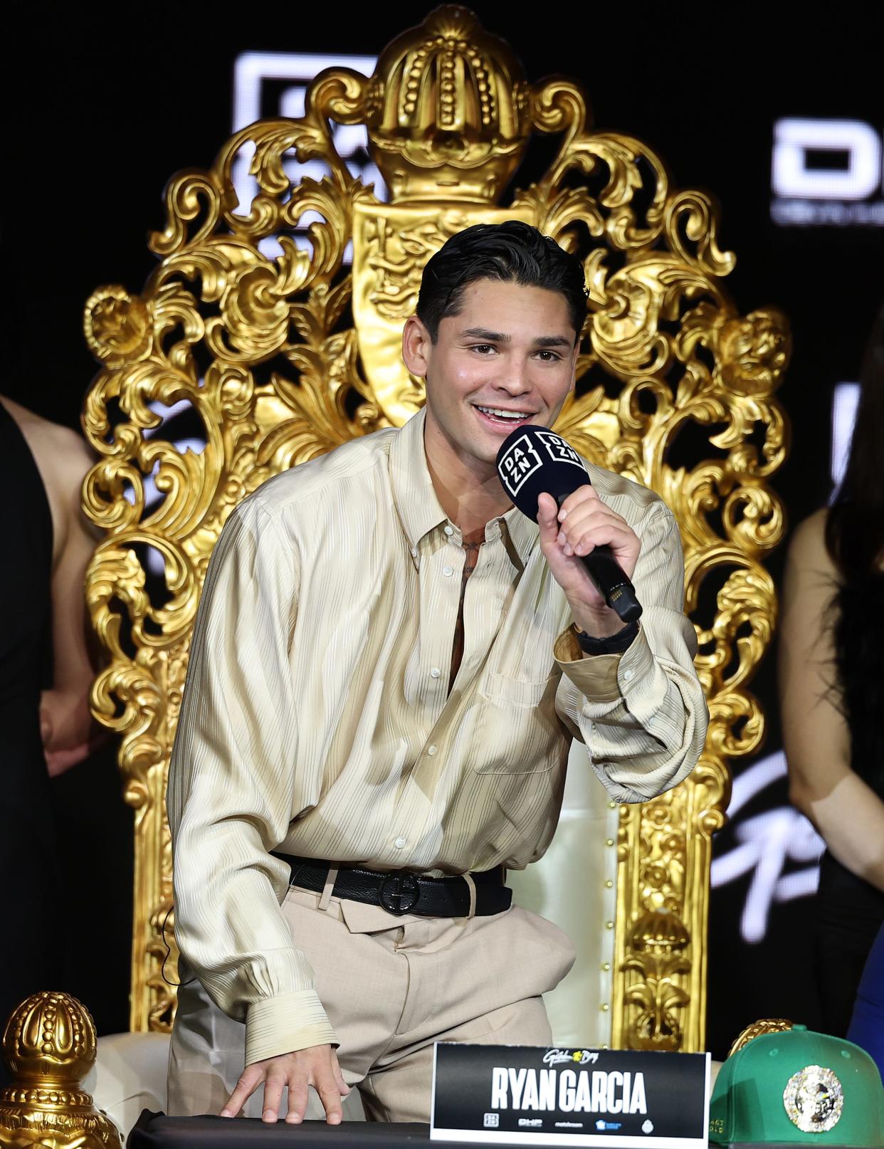 Ryan Garcia speaks from a makeshift throne during the press conference for his fight against Devin Haney at the Palladium Times Square on February 27, 2024 in New York.