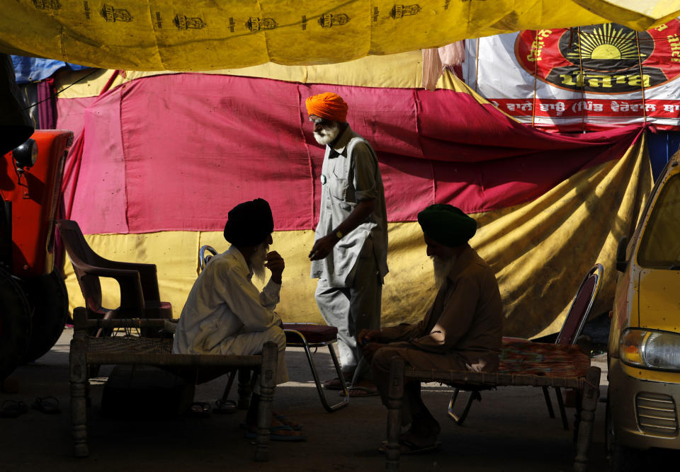 Indian farmers camp at Singhu, along the Delhi-Haryana border, against agricultural laws passed last year that they say will devastate their income, Friday, March 5, 2021. Saturday marks 100 days of the ongoing farmer protests against the contentious new agricultural reform laws which have led tens of thousands of farmers to blockade key highways leading to the capital. Multiple rounds of talks have failed to produce any breakthrough on the farmers' key demand to revoke the legislation. (AP Photo/Manish Swarup)