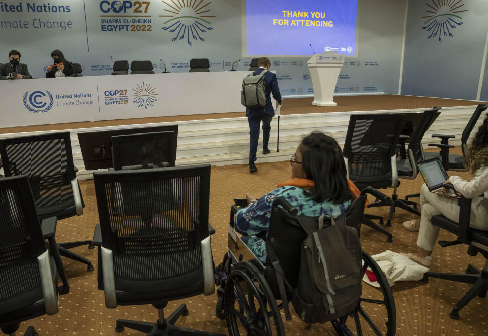 Jason Boberg, a member of the disability caucus and a founder of the disability climate action network SustainedAbility, walks up steps to attend a panel discussion, during the COP27 U.N. Climate Summit, in Sharm el-Sheikh, Egypt, Wednesday, Nov. 9, 2022. (AP Photo/Nariman El-Mofty)