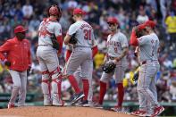 Los Angeles Angels manager Ron Washington, left, comes to the mound to relive Tyler Anderson (31) during the fifth inning of a baseball game against the Boston Red Sox, Sunday, April 14, 2024, in Boston. (AP Photo/Michael Dwyer)