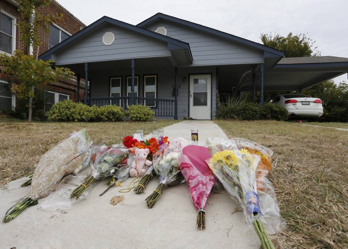 FILE - In this Monday, Oct. 14, 2019 photo, flowers lie on the sidewalk in front of the house in Fort Worth, Texas, where white Fort Worth police officer Aaron Dean shot and killed Atatiana Jefferson, a Black woman, through a back window of her home. Dean was not heard identifying himself as police on the bodycam video, and then-Police Chief Ed Kraus said there was no sign Dean or the other officer who responded knocked on the front door. Dean resigned and is charged with murder.