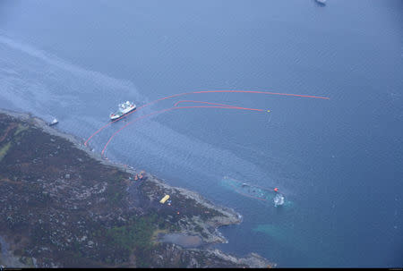 A shipwrecked Norwegian navy frigate "KNM Helge Ingstad" is seen in this Norwegian Coastal Administration handout picture in Oygarden, Norway, November 13, 2018. Norwegian Coastal Administration/Handout vis REUTERS ATTENTION EDITORS - THIS IMAGE WAS PROVIDED BY A THIRD PARTY. NO RESALES. NO ARCHIVES