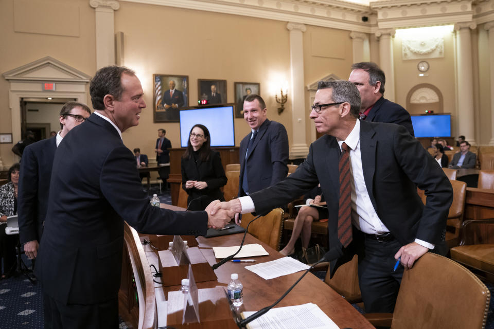 House Intelligence Committee Chairman Adam Schiff, D-Calif., left, greets witness Clint Watts, a cybersecurity and intelligence expert with the Foreign Policy Research Institute, at a hearing on politically motivated fake videos and manipulated media, on Capitol Hill in Washington, on June 13, 2019.  (Photo: J. Scott Applewhite/AP)