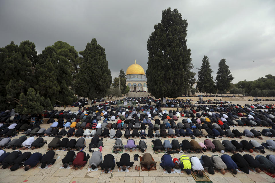 Muslim men pray during Friday prayer, next to the Dome of the Rock Mosque in the Al Aqsa Mosque compound in Jerusalem's old city, Friday, Nov. 6, 2020. The Palestinian leadership has condemned the United Arab Emirates' decision to forge ties with Israel as a "betrayal," but it could lead to a tourism bonanza for Palestinians in east Jerusalem as Israel courts wealthy Gulf travelers. (AP Photo/Mahmoud Illean)