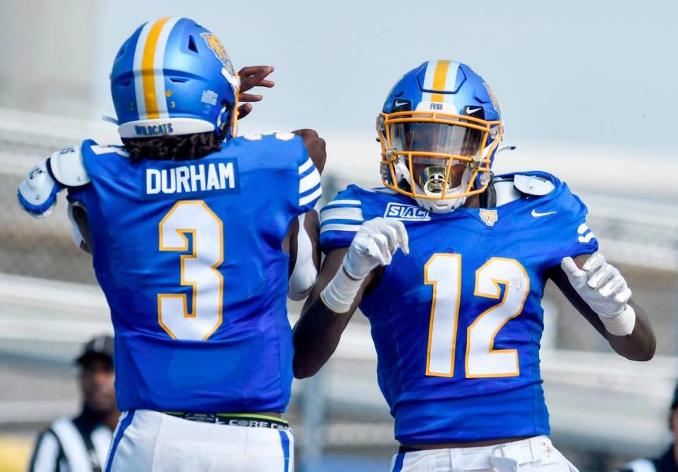 Fort Valley State receiver Corintheus Edmonds (12) celebrates a touchdown reception with quarterback Kelvin Durham (3) during the Wildcats 29-27 win Saturday over Allen University.