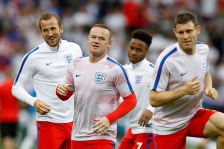 Football Soccer - Slovakia v England - EURO 2016 - Group B - Stade Geoffroy-Guichard, Saint-Étienne, France - 20/6/16 (L - R) England's Harry Kane, Wayne Rooney, Raheem Sterling and James Milner warm up before the match REUTERS/Lee Smith Livepic